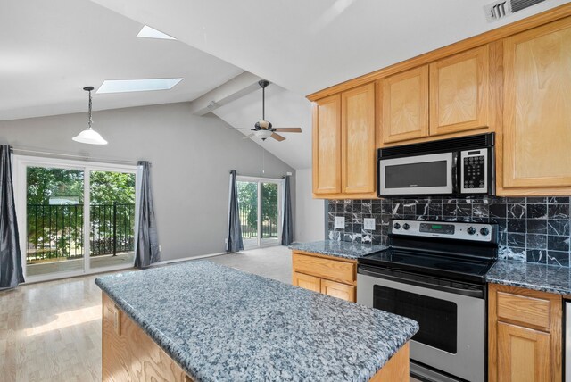 kitchen with light brown cabinetry, backsplash, lofted ceiling with skylight, ceiling fan, and stainless steel range with electric cooktop