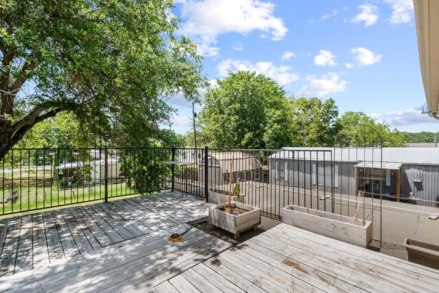 wooden terrace with a fire pit