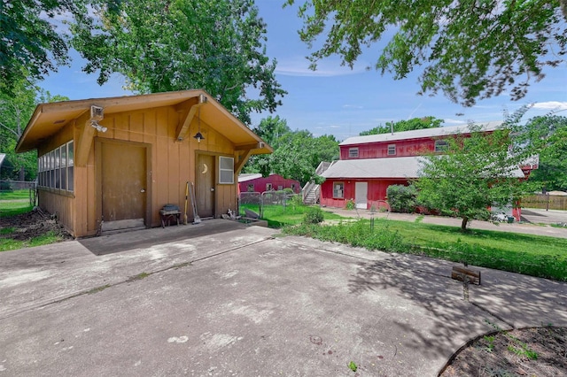 view of side of property with a lawn