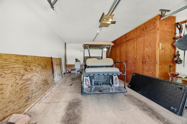 interior space featuring a garage door opener and wooden walls