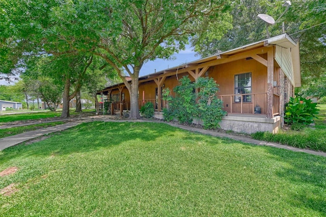 view of front of house featuring a front yard and a porch