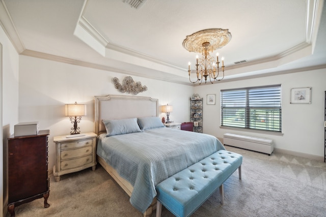 carpeted bedroom with a raised ceiling, ornamental molding, and an inviting chandelier