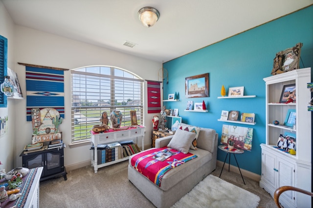 bedroom featuring multiple windows and light colored carpet