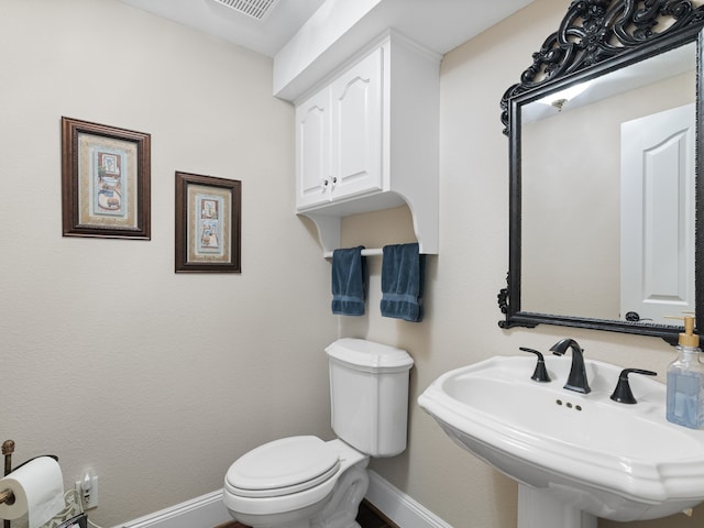 bathroom with sink and toilet