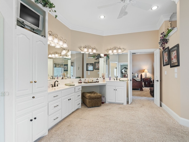 bathroom featuring crown molding, ceiling fan, and vanity