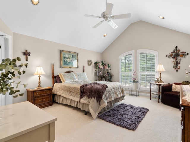 bedroom with ceiling fan, lofted ceiling, and light carpet