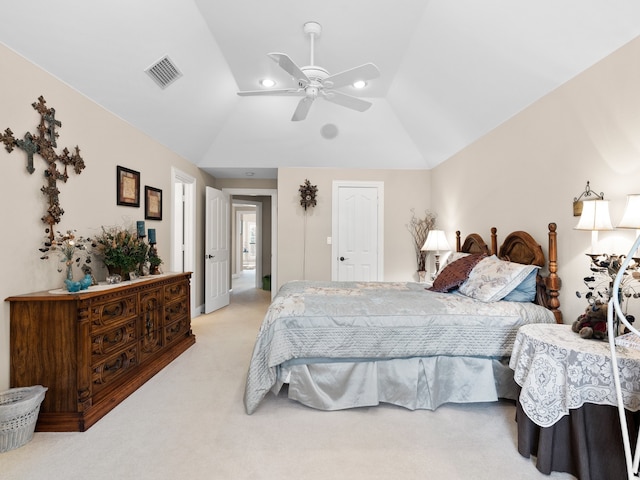 bedroom featuring lofted ceiling, ceiling fan, and light colored carpet