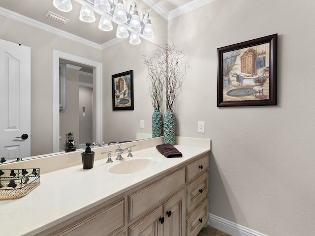 bathroom with crown molding and vanity