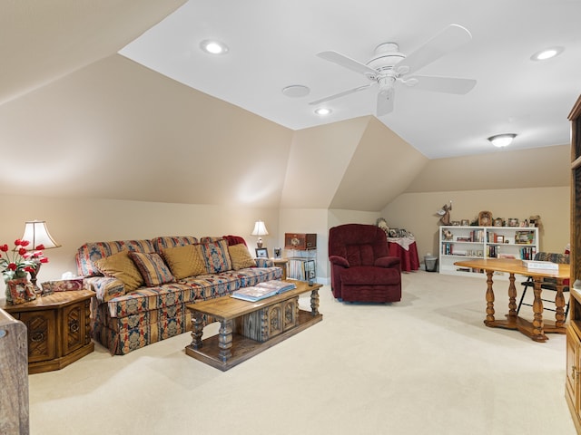 carpeted living room featuring ceiling fan and vaulted ceiling