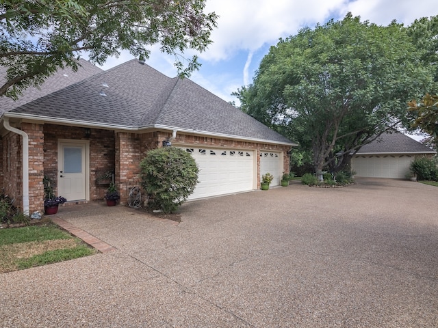 ranch-style house featuring a garage