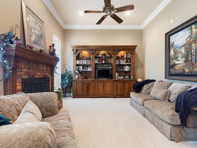 carpeted living room featuring a brick fireplace, crown molding, and ceiling fan