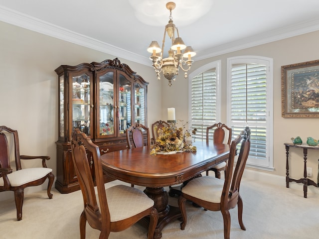 dining space featuring a notable chandelier, crown molding, and light colored carpet