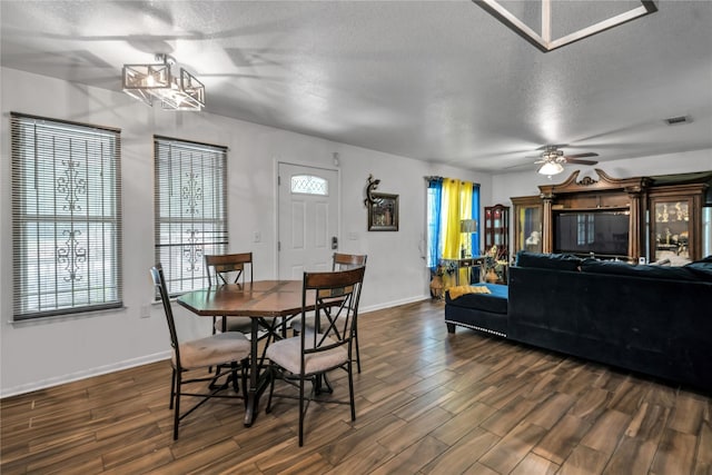 dining room featuring a textured ceiling and ceiling fan