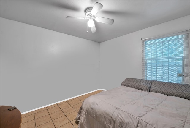 bedroom featuring ceiling fan and light tile patterned flooring