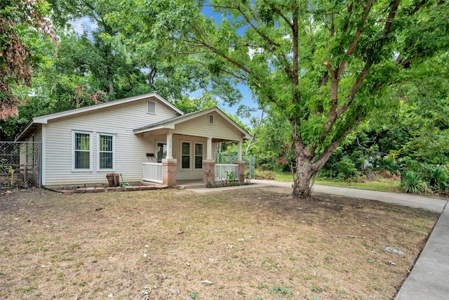 view of front of house featuring a front lawn and a porch