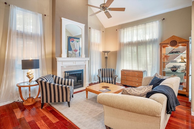 living room featuring wood-type flooring, high vaulted ceiling, and ceiling fan