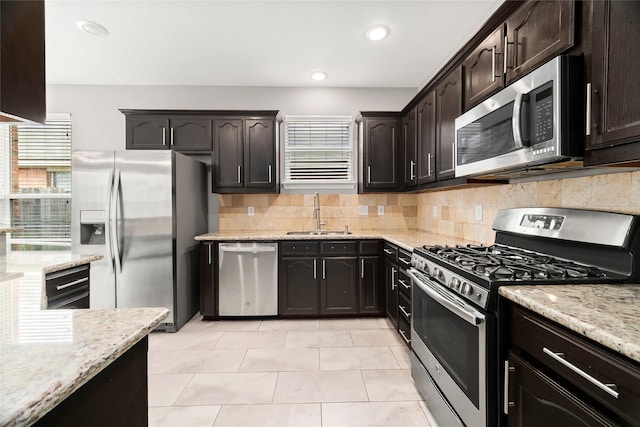 kitchen with sink, dark brown cabinetry, and stainless steel appliances