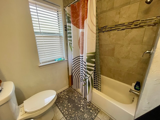 bathroom featuring tile patterned floors, toilet, and shower / bath combo with shower curtain