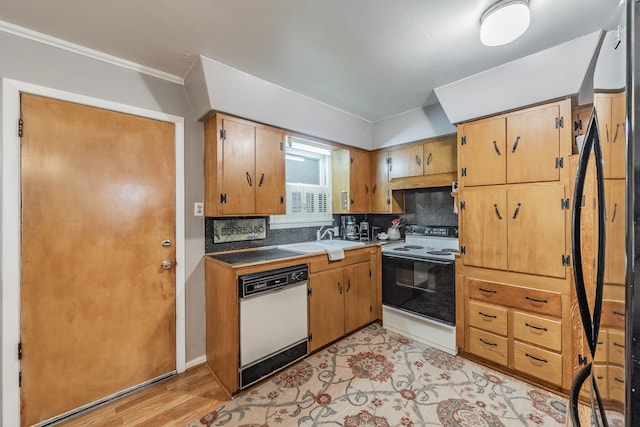 kitchen with white appliances, sink, crown molding, light hardwood / wood-style flooring, and backsplash