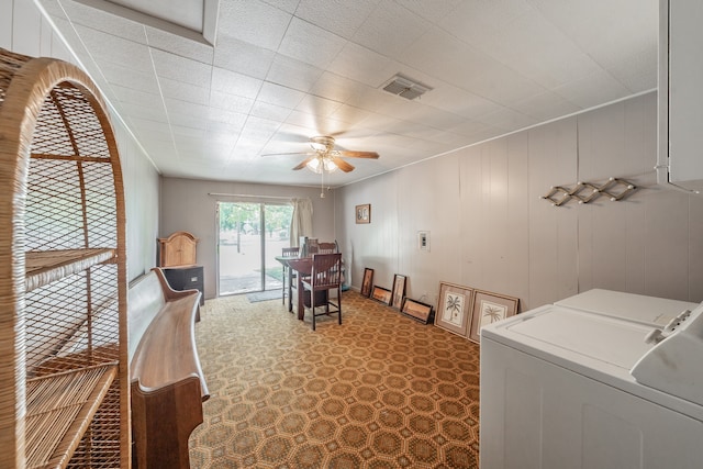 interior space with washing machine and dryer and ceiling fan