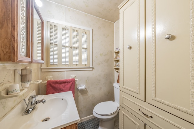 bathroom featuring vanity and toilet