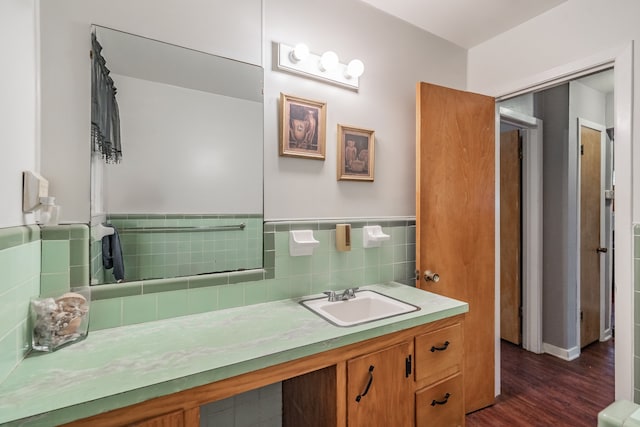 bathroom with wood-type flooring, backsplash, and vanity