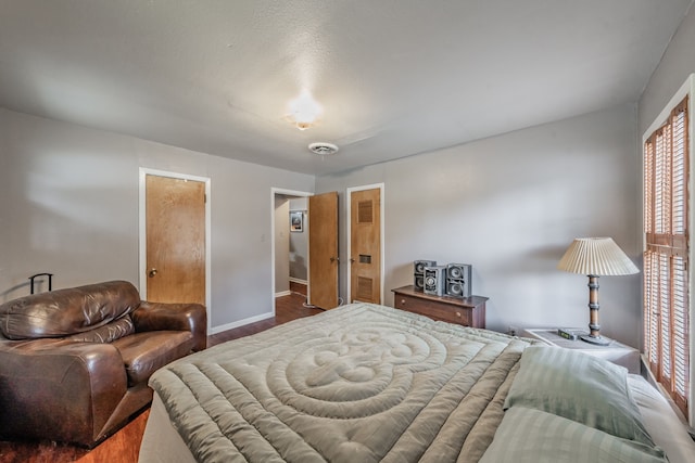 bedroom featuring dark hardwood / wood-style flooring