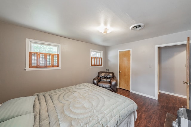 bedroom featuring dark hardwood / wood-style flooring