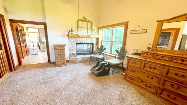 living area with carpet and a fireplace