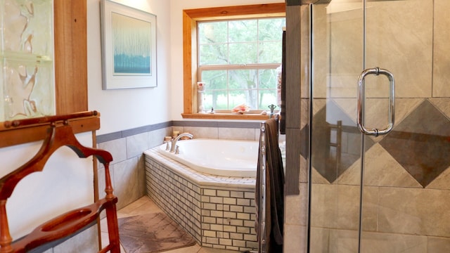 bathroom featuring tile patterned flooring and plus walk in shower