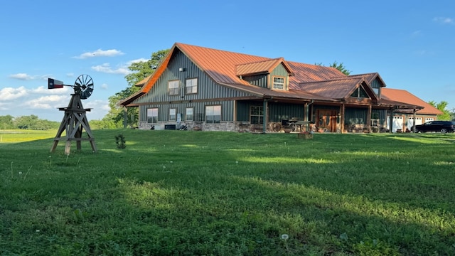 rear view of house with a lawn