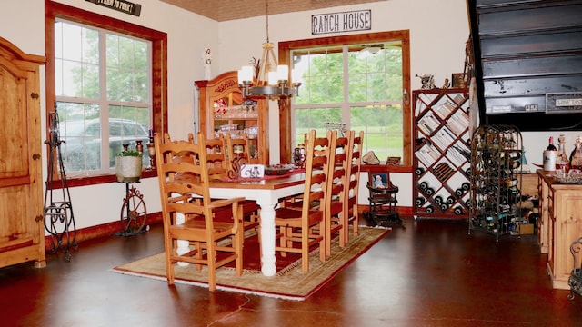 dining room with a chandelier and a wealth of natural light