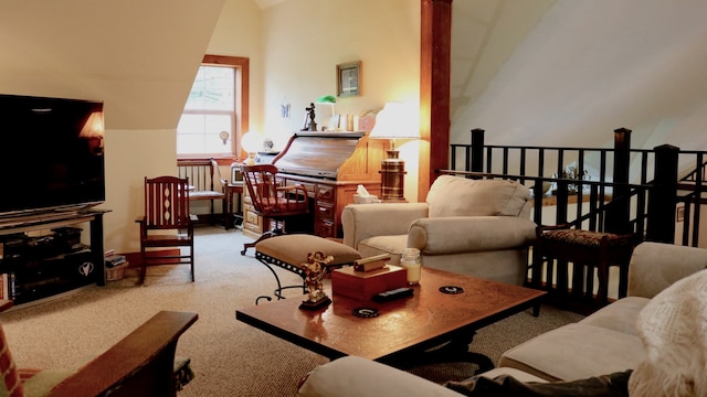 living room with carpet floors and vaulted ceiling