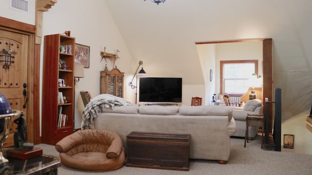 living room featuring high vaulted ceiling and carpet