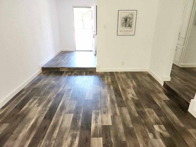 spare room with dark wood-type flooring