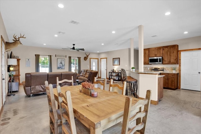 dining space with ceiling fan, finished concrete floors, visible vents, and recessed lighting