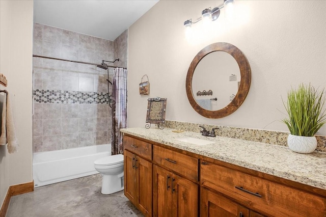 bathroom featuring shower / tub combo, vanity, and toilet