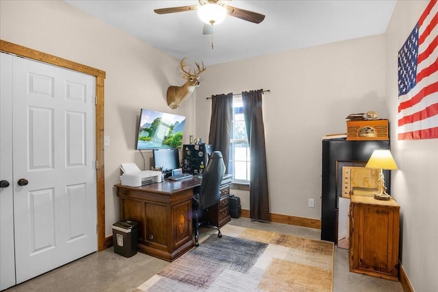 office area featuring ceiling fan and baseboards