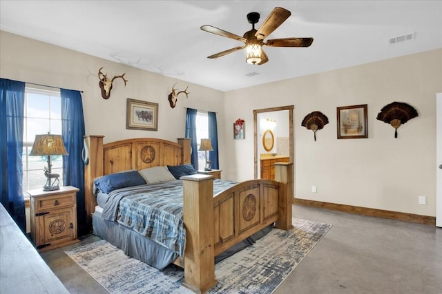 bedroom with visible vents, ceiling fan, finished concrete flooring, and baseboards