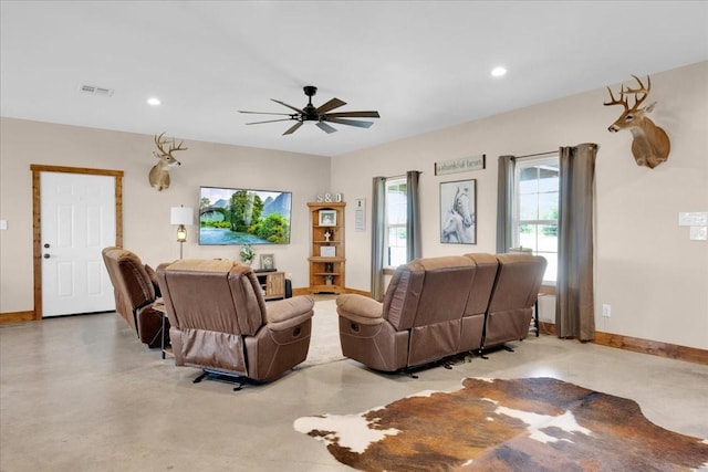 living area featuring recessed lighting, a ceiling fan, visible vents, finished concrete flooring, and baseboards