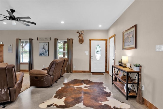 entrance foyer featuring concrete floors, baseboards, a ceiling fan, and recessed lighting