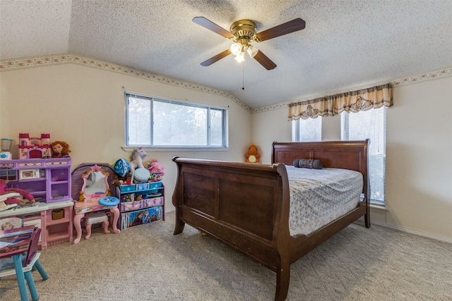 carpeted bedroom featuring vaulted ceiling, a textured ceiling, and ceiling fan