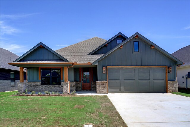 view of front of property with a garage and a front yard