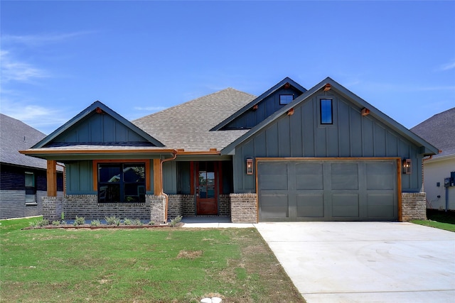 view of front of property with a garage and a front yard