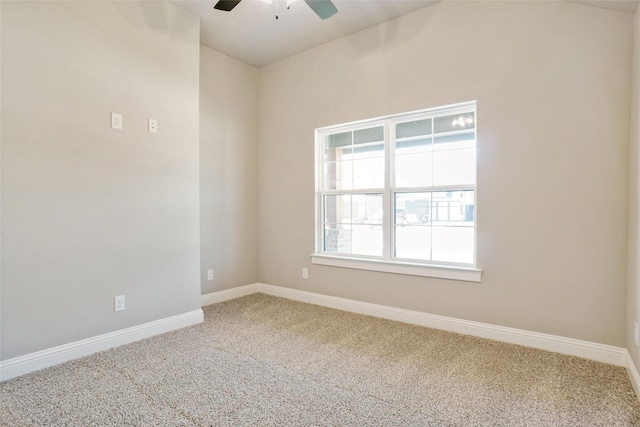 spare room featuring carpet flooring and ceiling fan