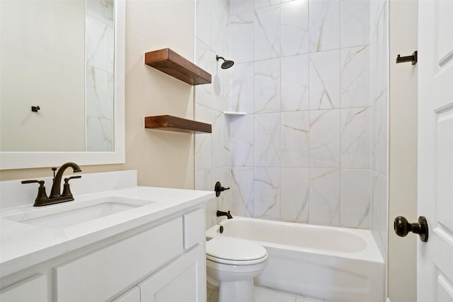 full bathroom with tiled shower / bath, vanity, and toilet