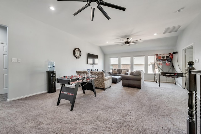 recreation room featuring ceiling fan, light colored carpet, and vaulted ceiling