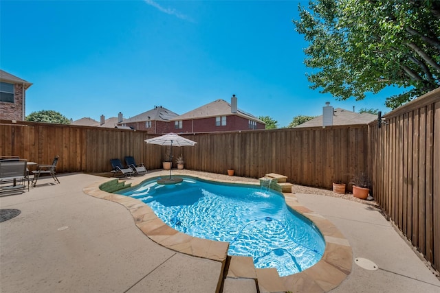 view of swimming pool with a patio area and pool water feature