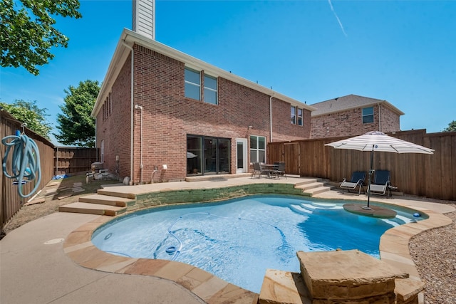 view of swimming pool featuring a patio