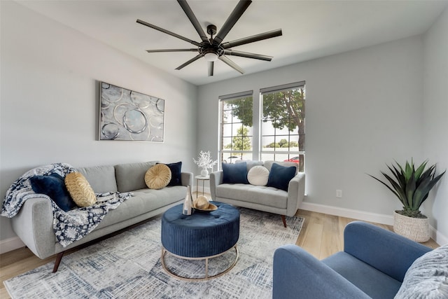 living room with ceiling fan and wood-type flooring